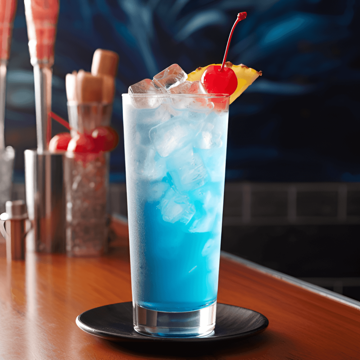 Blue Ocean Cóctel Receta - El Blue Ocean es un cóctel dulce y afrutado con un refrescante sabor tropical. El curacao azul le da un toque cítrico, mientras que el jugo de piña agrega una dulzura ácida. El vodka proporciona una base fuerte y suave que equilibra la dulzura de los otros ingredientes.