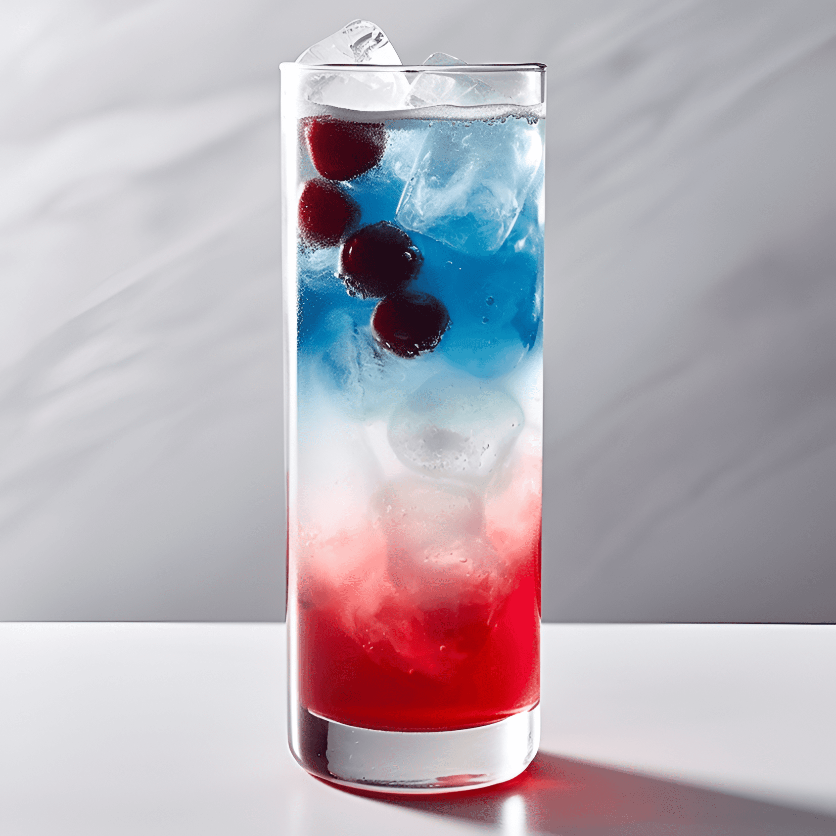 Red, White, and Blue Cocktail Recipe - The Red, White, and Blue cocktail offers a delightful combination of sweet, fruity, and slightly tart flavors. The grenadine provides a sweet and tangy base, while the blue curaçao adds a hint of citrus and tropical fruit. The cream layer balances out the flavors with its smooth and velvety texture.